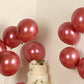 Chrome pink biodegradable latex balloons in a party setting.