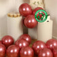 Chrome pink biodegradable latex balloons in a party setting.