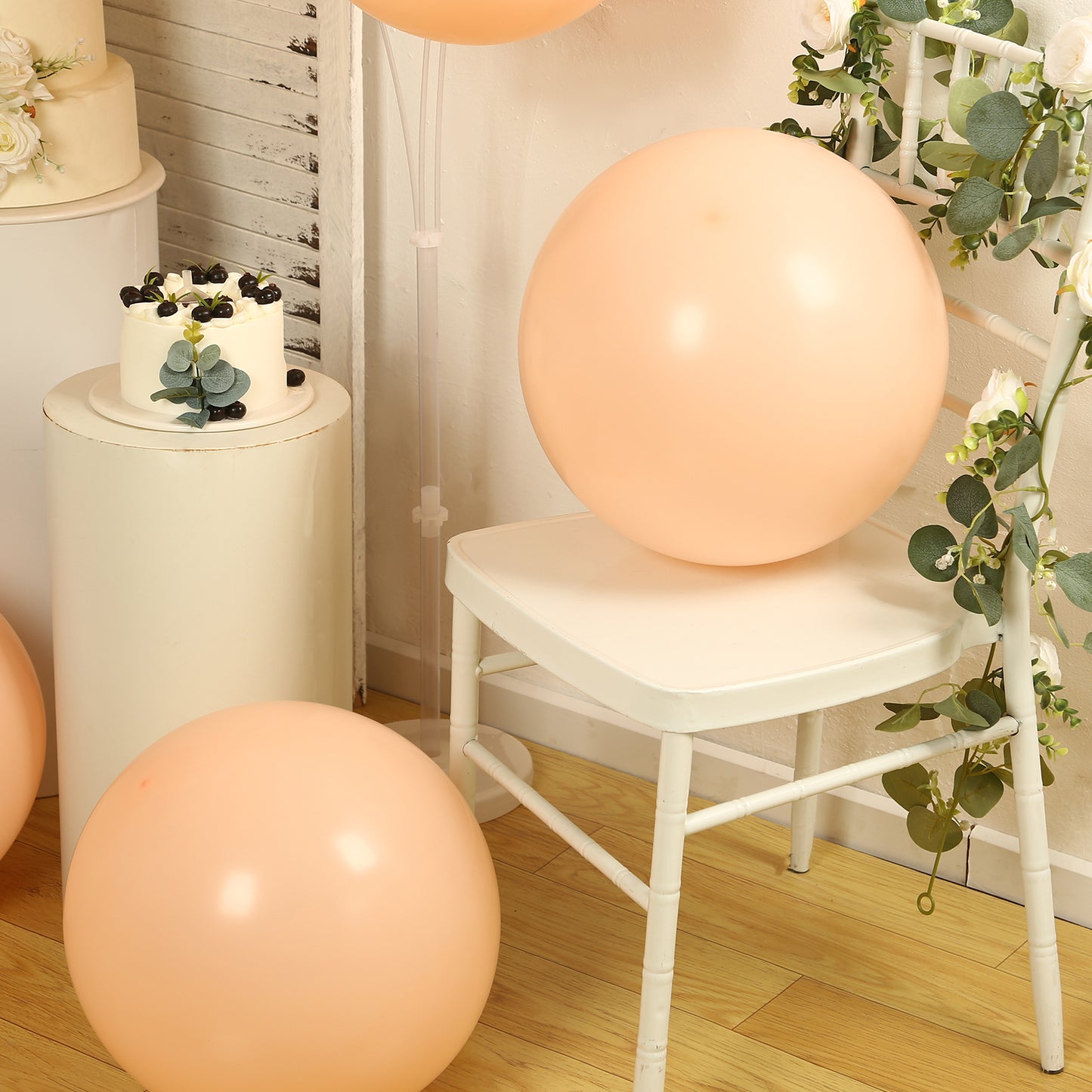 peach biodegradable balloons in a rustic setting