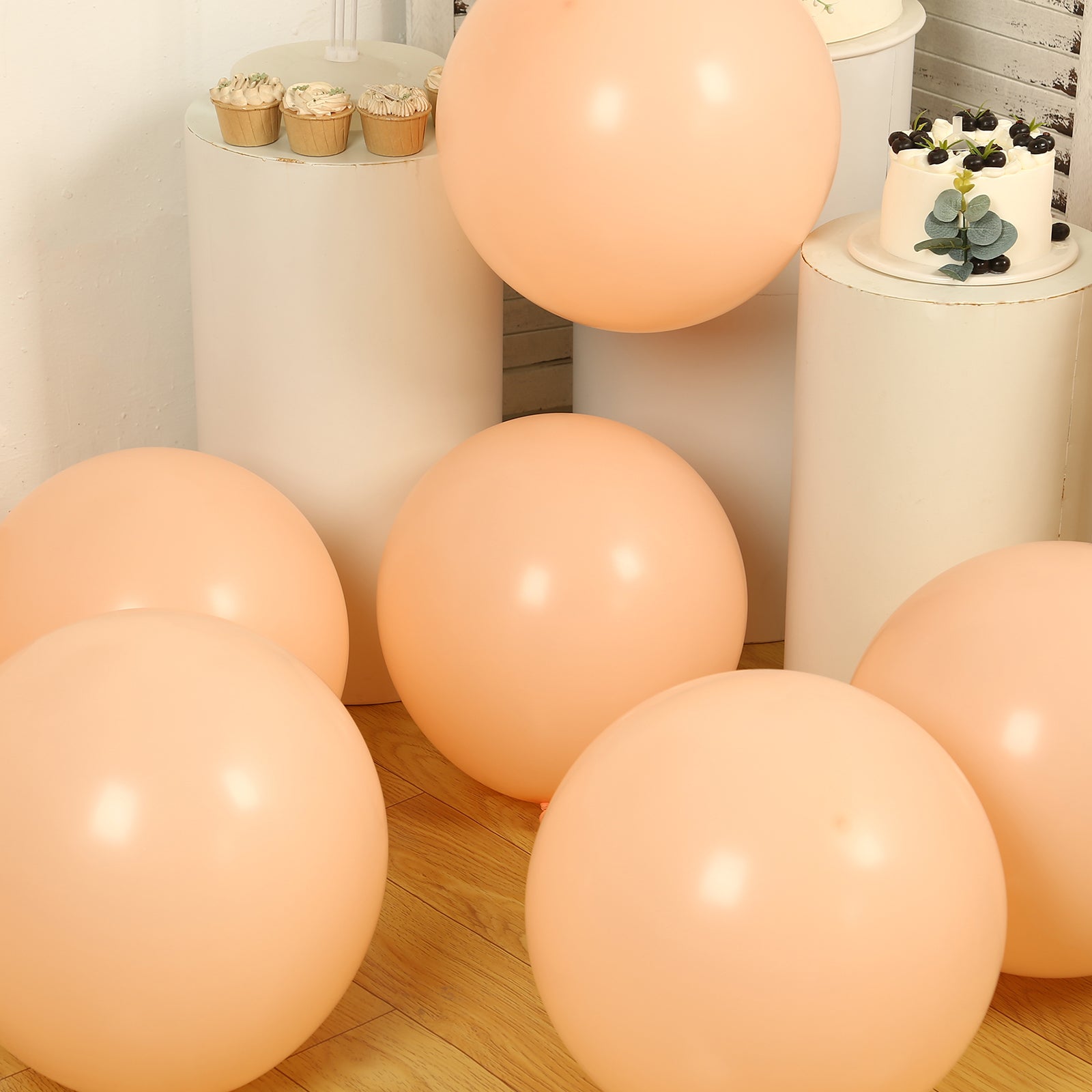 Matte pastel blush biodegradable balloons in a festive setting.