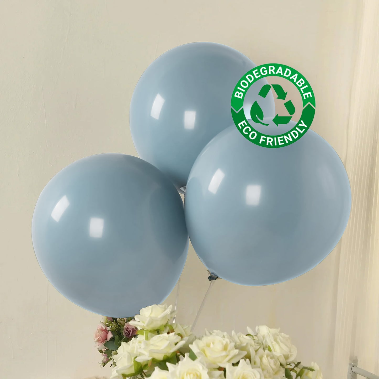 Matte pastel dusty blue biodegradable balloons in a bouquet setting.
