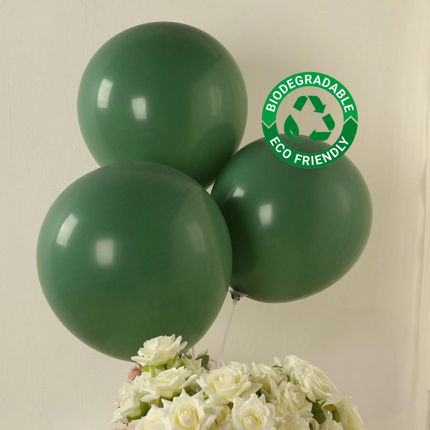 Matte pastel dusty sage green biodegradable balloons, eco-friendly party decor.