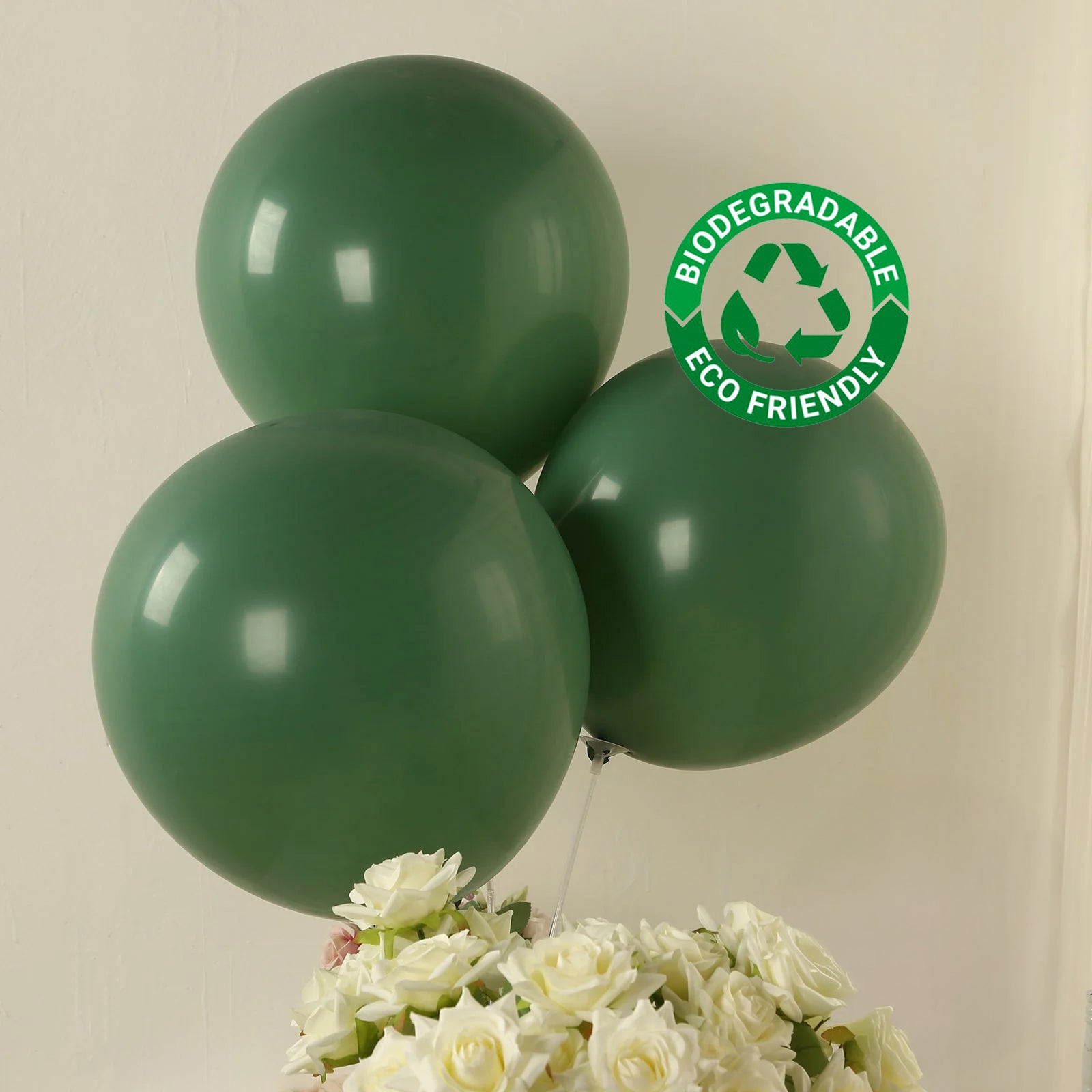 Matte pastel dusty sage green biodegradable balloons, eco-friendly party decor.