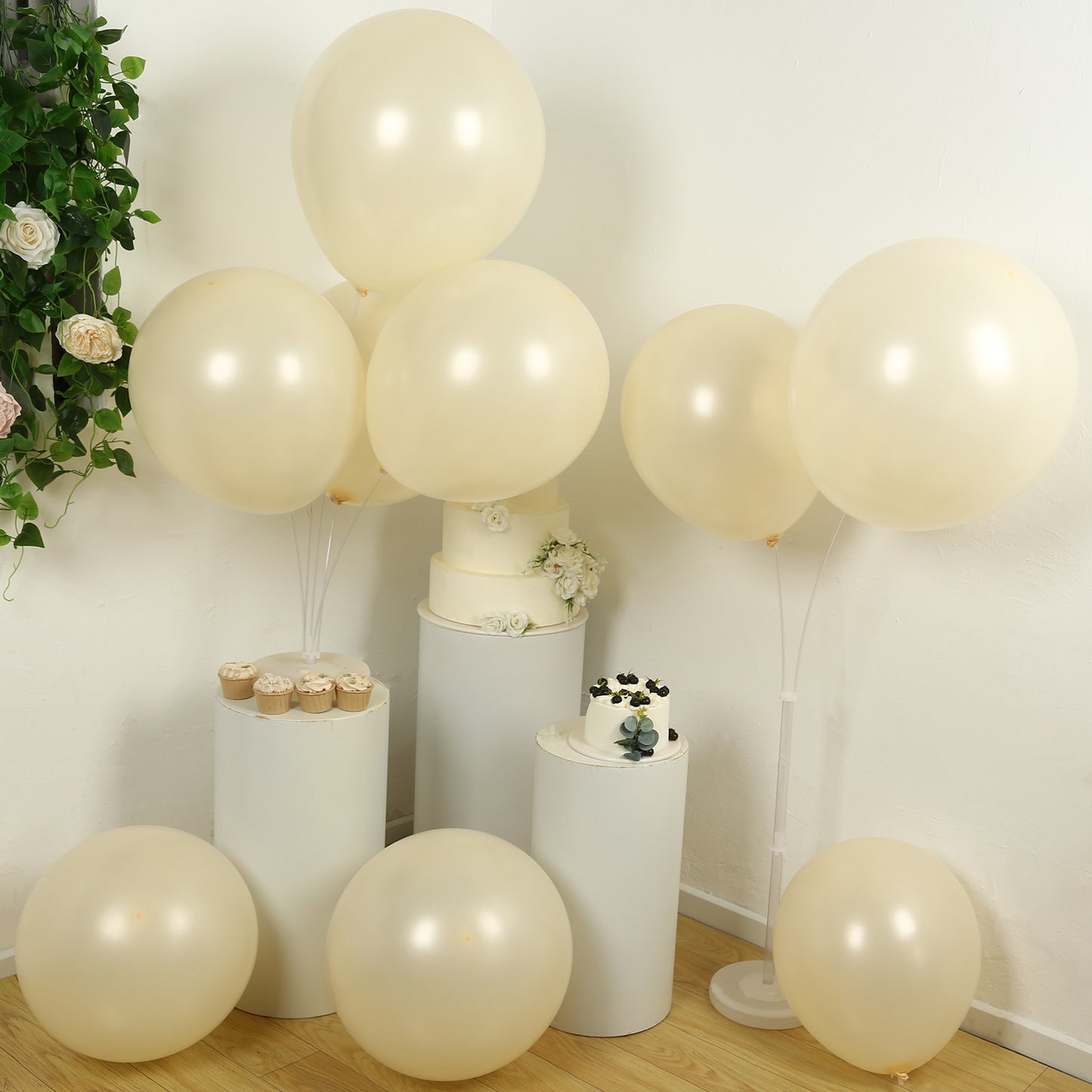 Matte pastel cream biodegradable balloons arranged at a party setting.