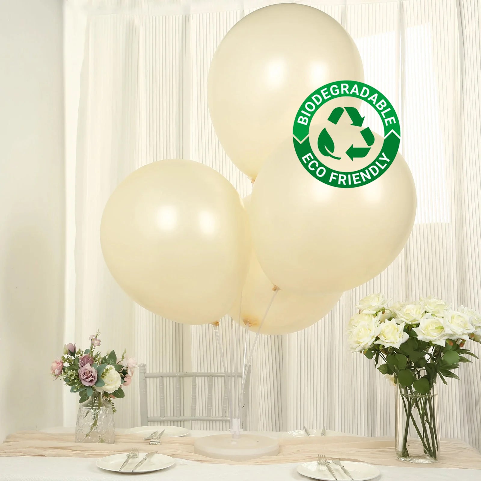 Matte pastel cream biodegradable balloons on a table setting.