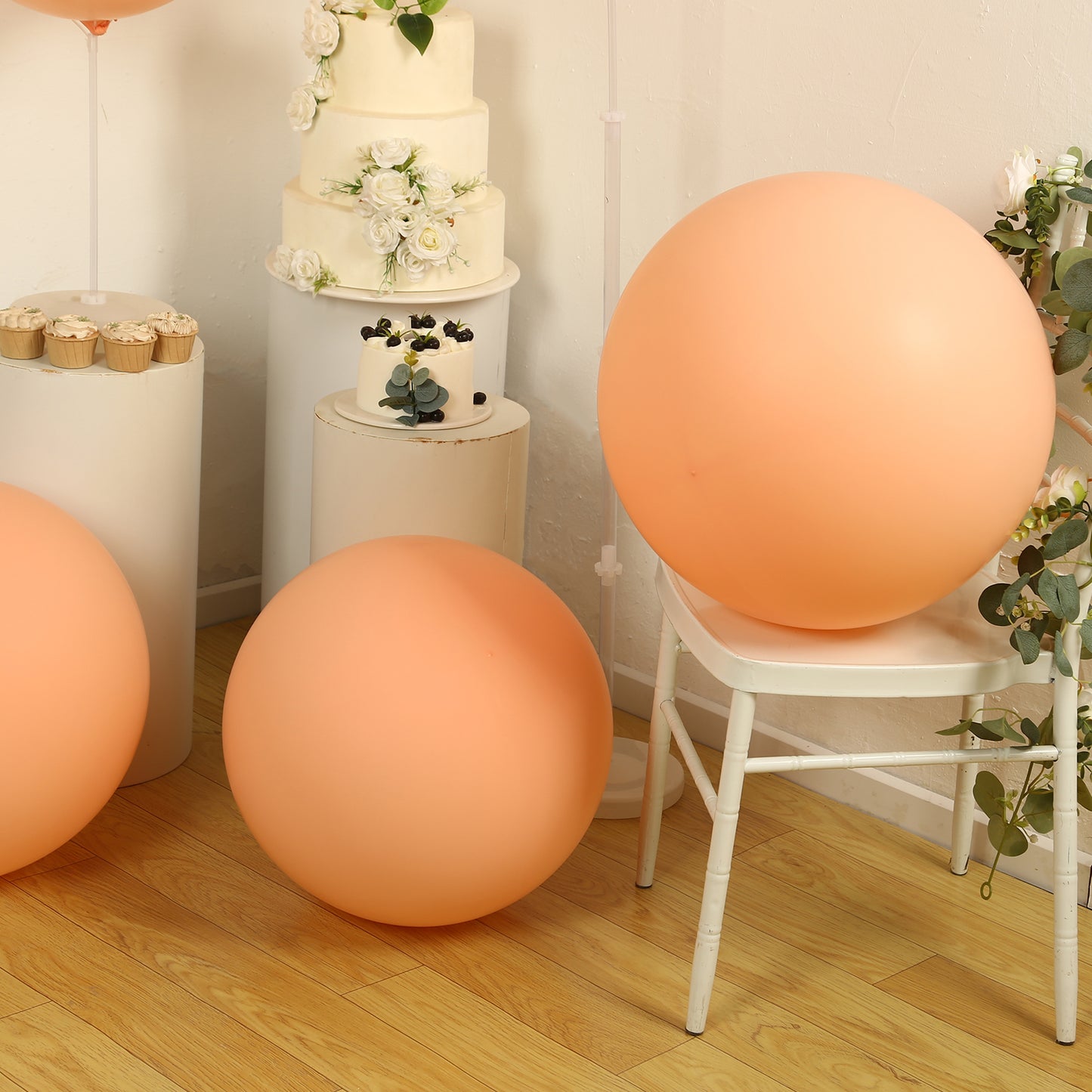 Large matte pastel blush biodegradable balloons in an eco-friendly setting.