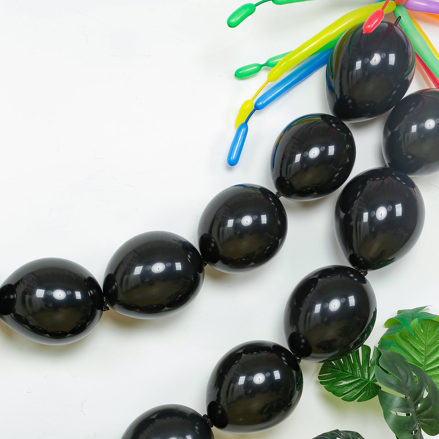 Matte pastel black biodegradable link balloons for decor and garlands.