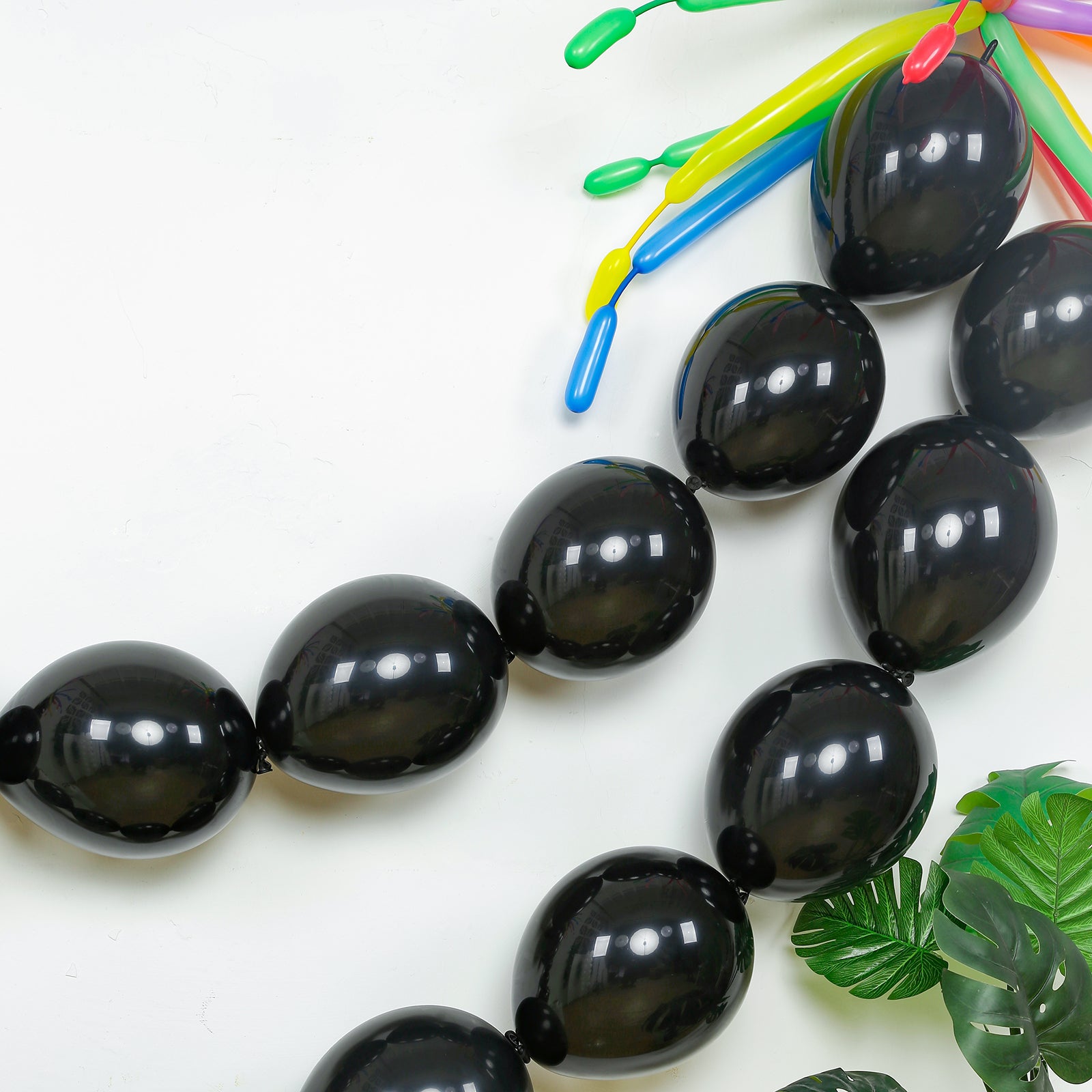 Matte pastel black biodegradable link balloons for decor and garlands.