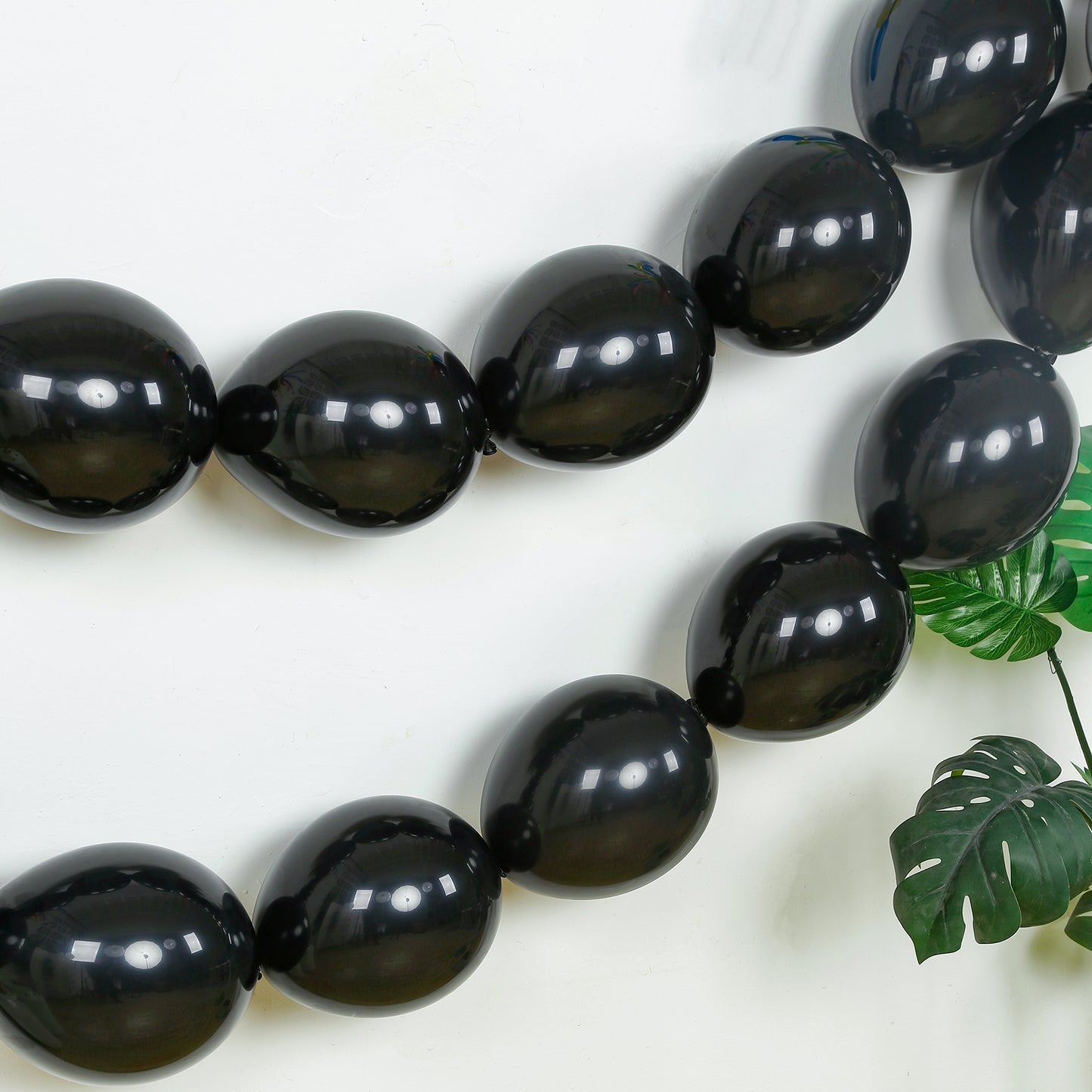 Matte pastel black biodegradable linking balloons for decor.
