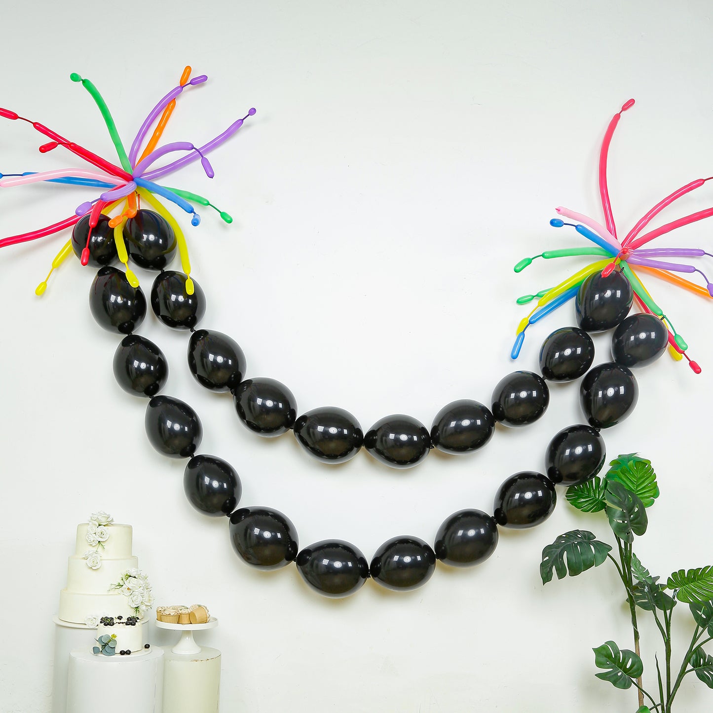 Matte pastel black biodegradable linking balloons for decor.
