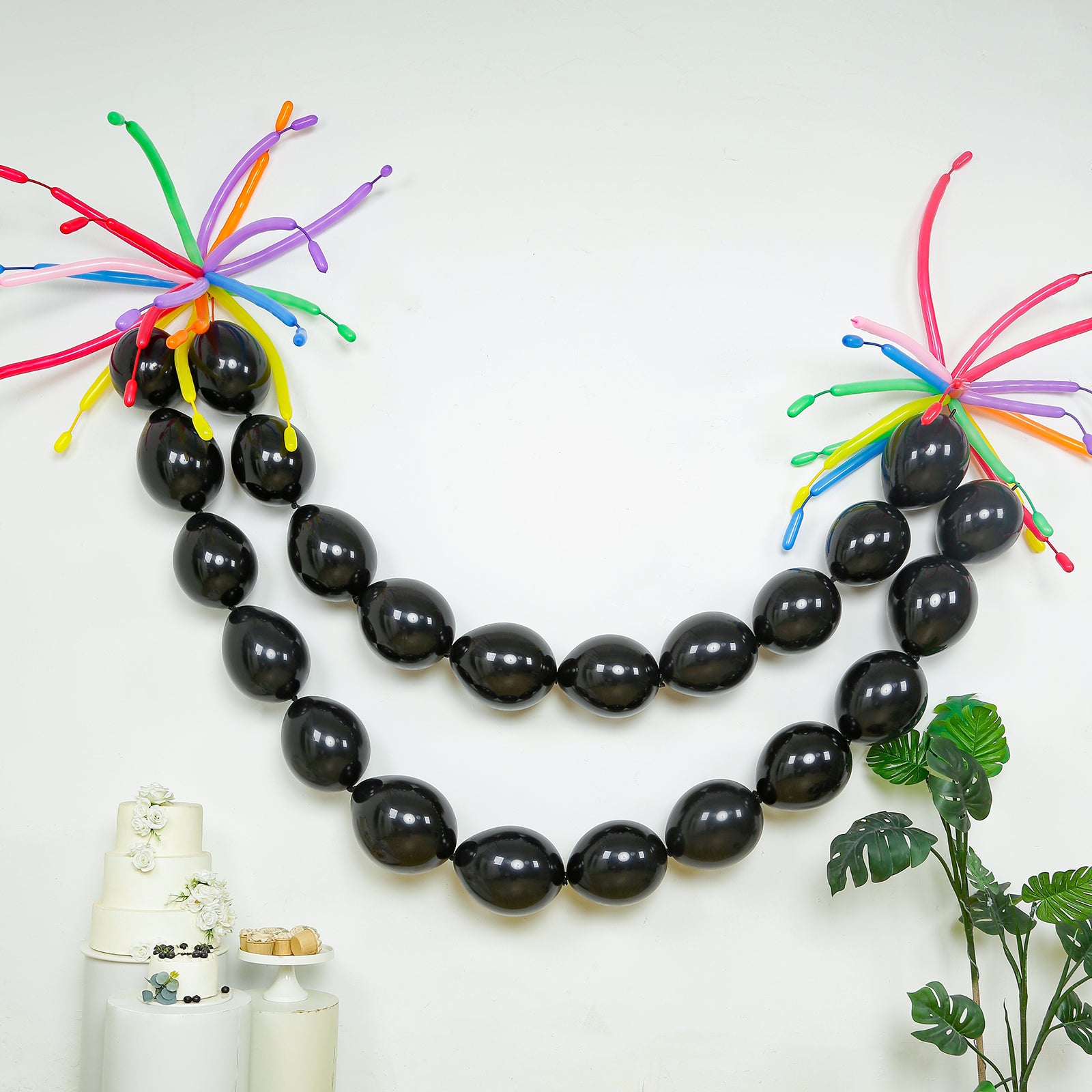 Matte pastel black biodegradable linking balloons for decor.