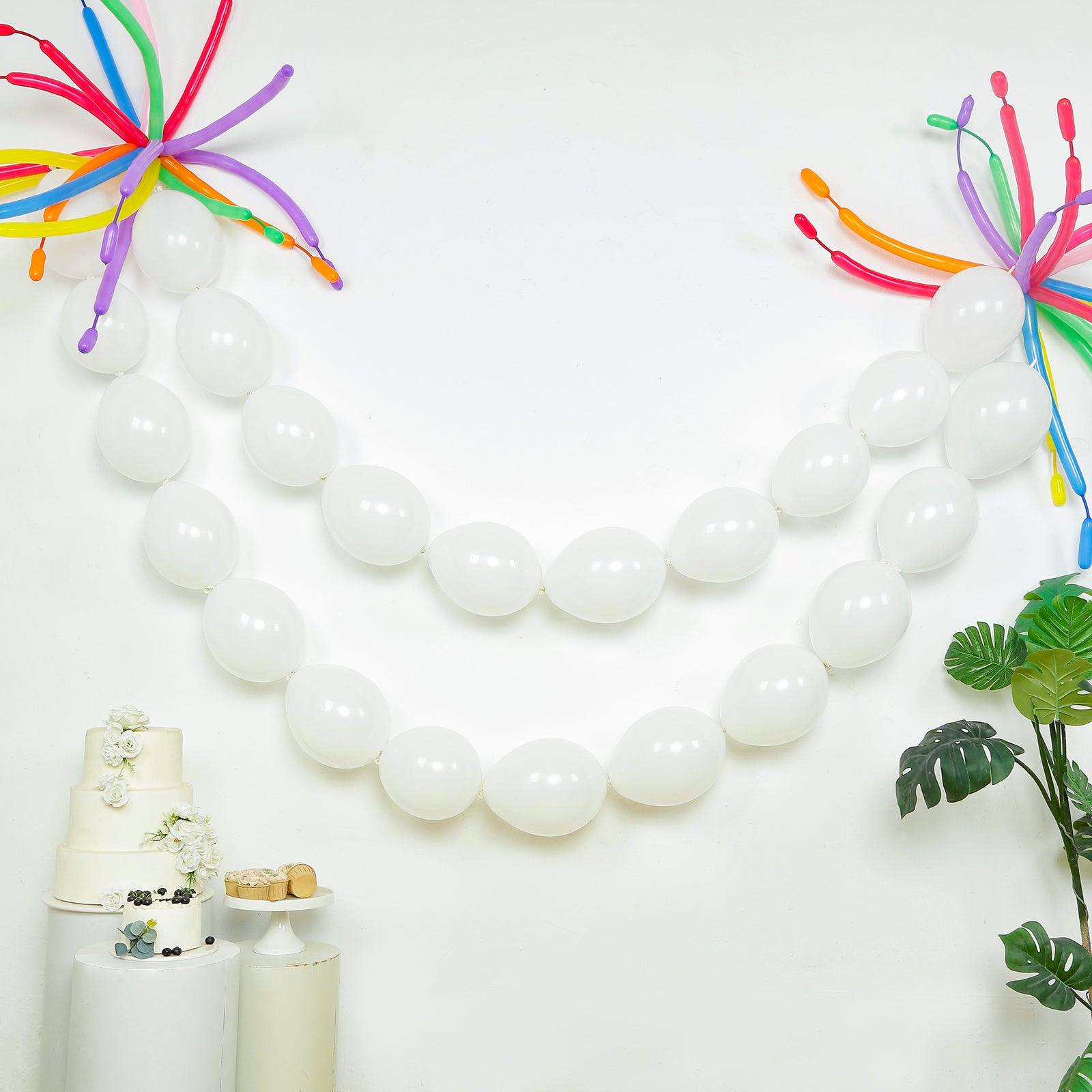 Matte pastel white biodegradable link balloons for decor.