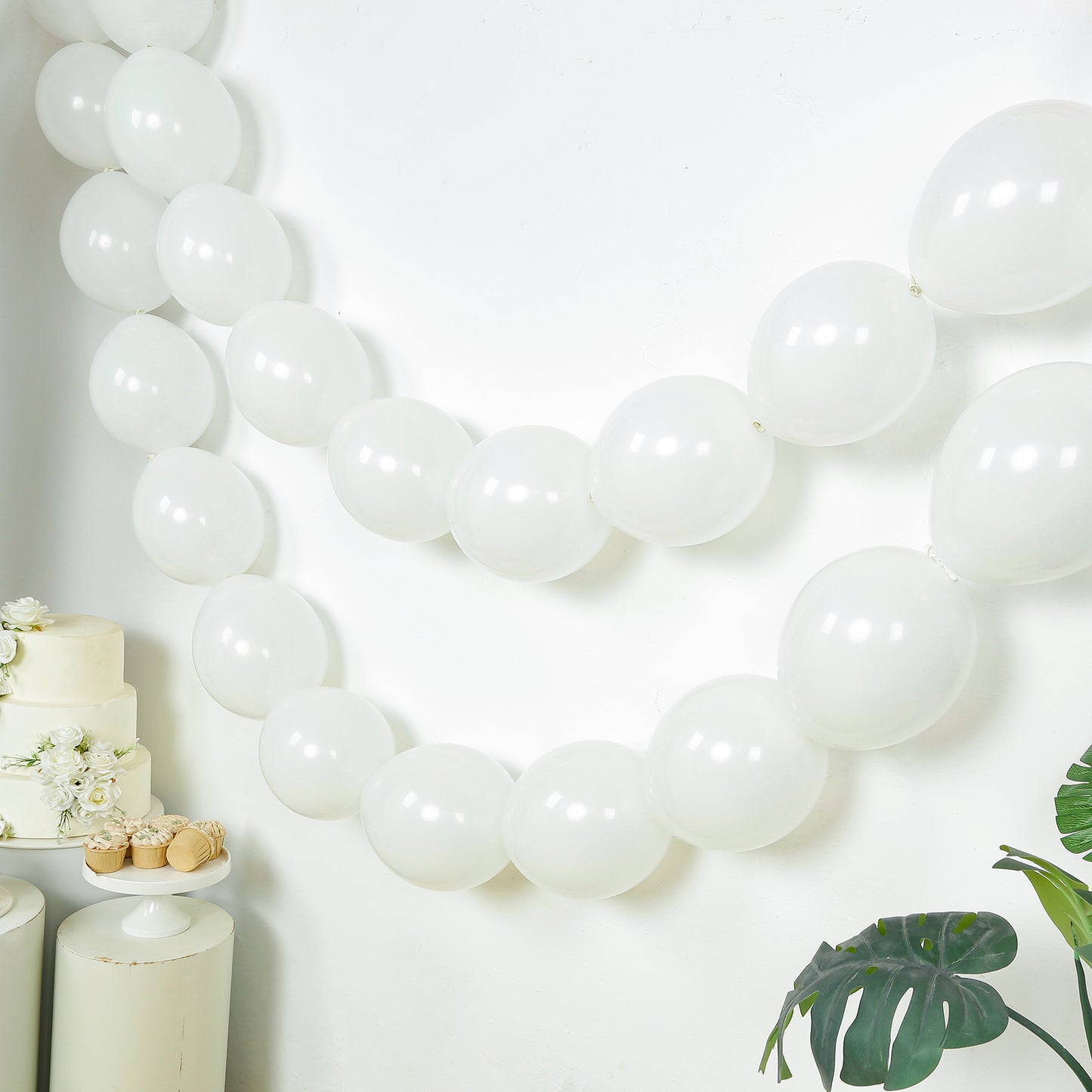 Matte pastel white biodegradable linking balloons for decor.
