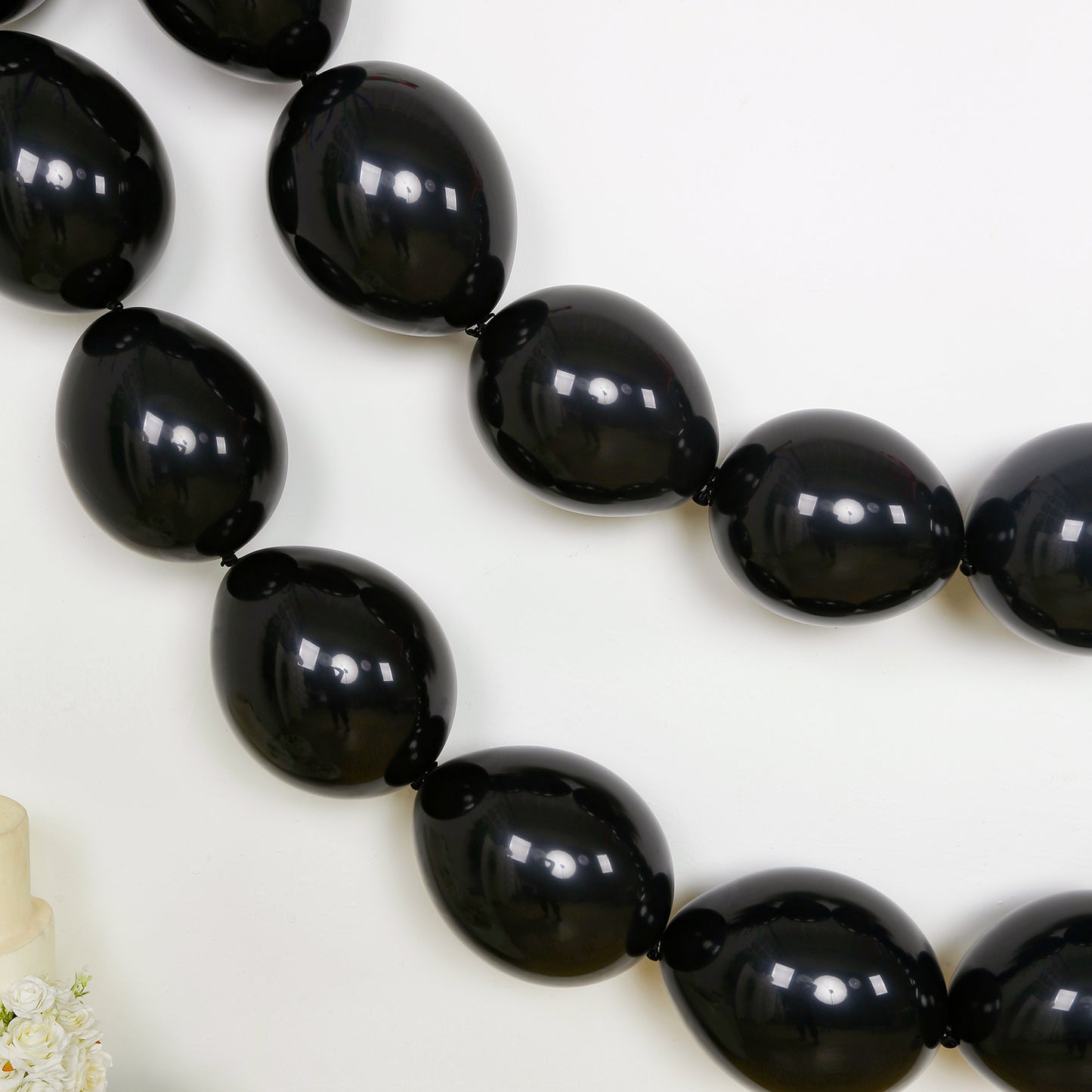 Matte pastel black biodegradable linking balloons for decor.