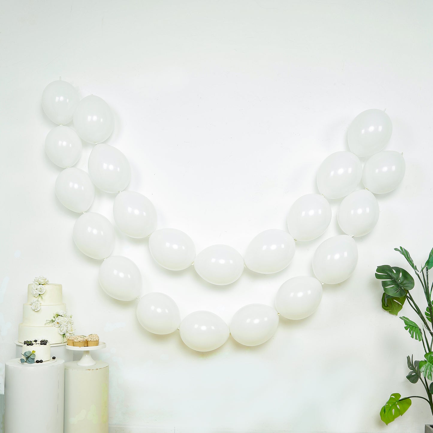 Matte pastel white biodegradable link balloons for decor.