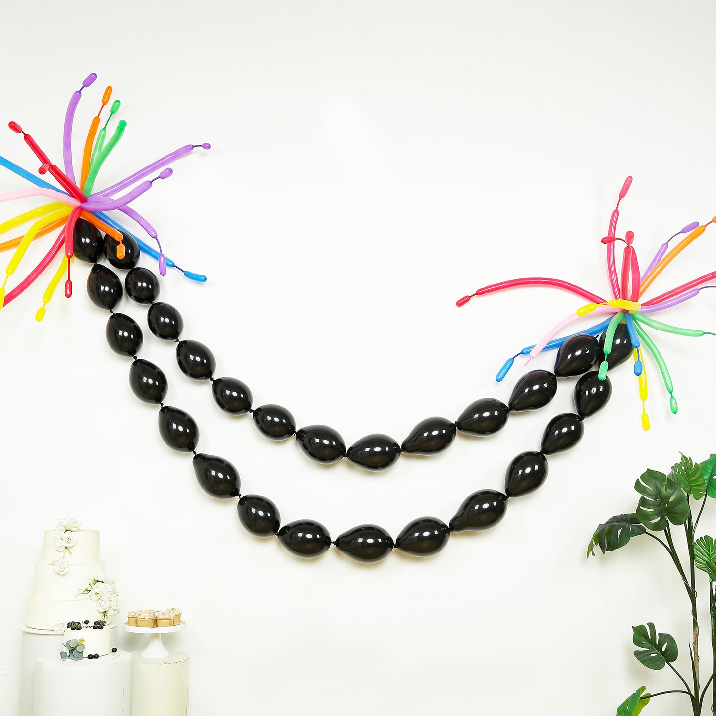 Matte pastel black biodegradable linking balloons for decor.