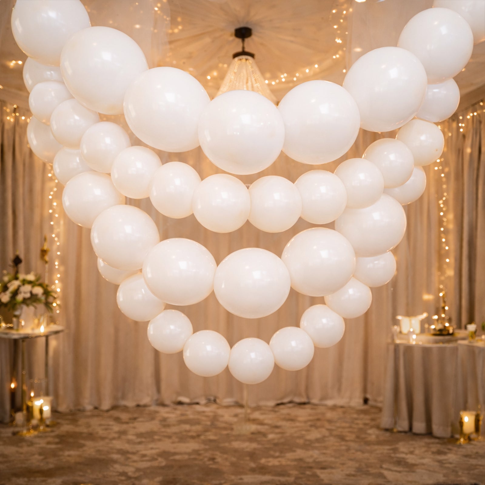 Matte pastel white biodegradable link balloons in a decorative garland.
