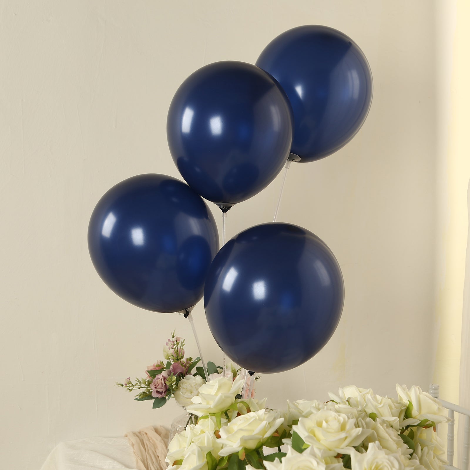 Navy blue biodegradable helium balloons in a decorative arrangement.
