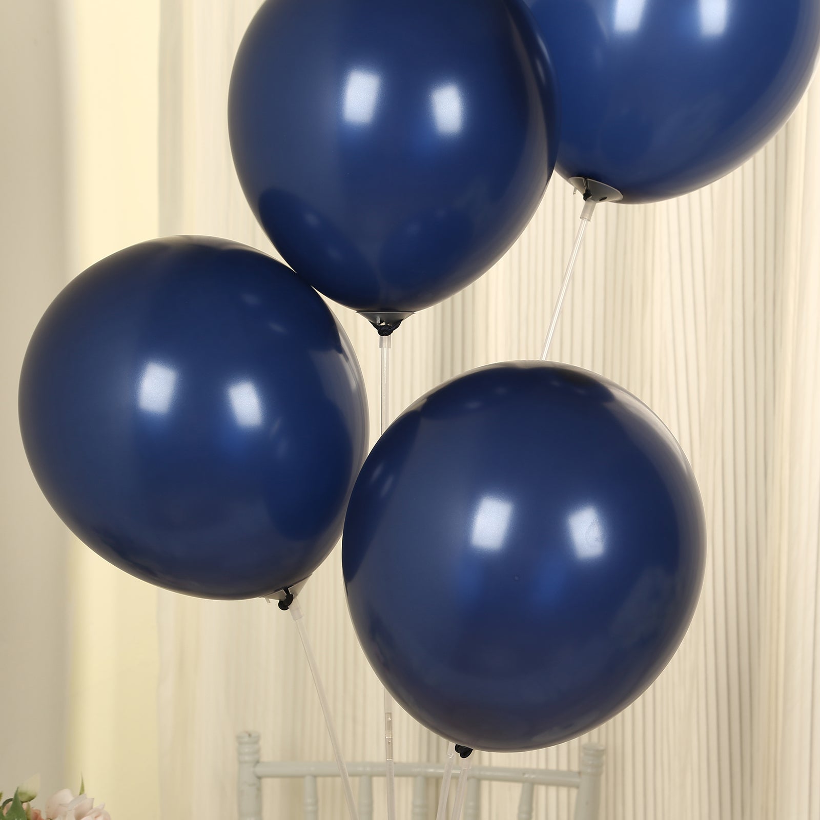 Navy blue biodegradable helium balloons in a party setting.