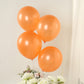Orange biodegradable balloons for eco-friendly party decorations.