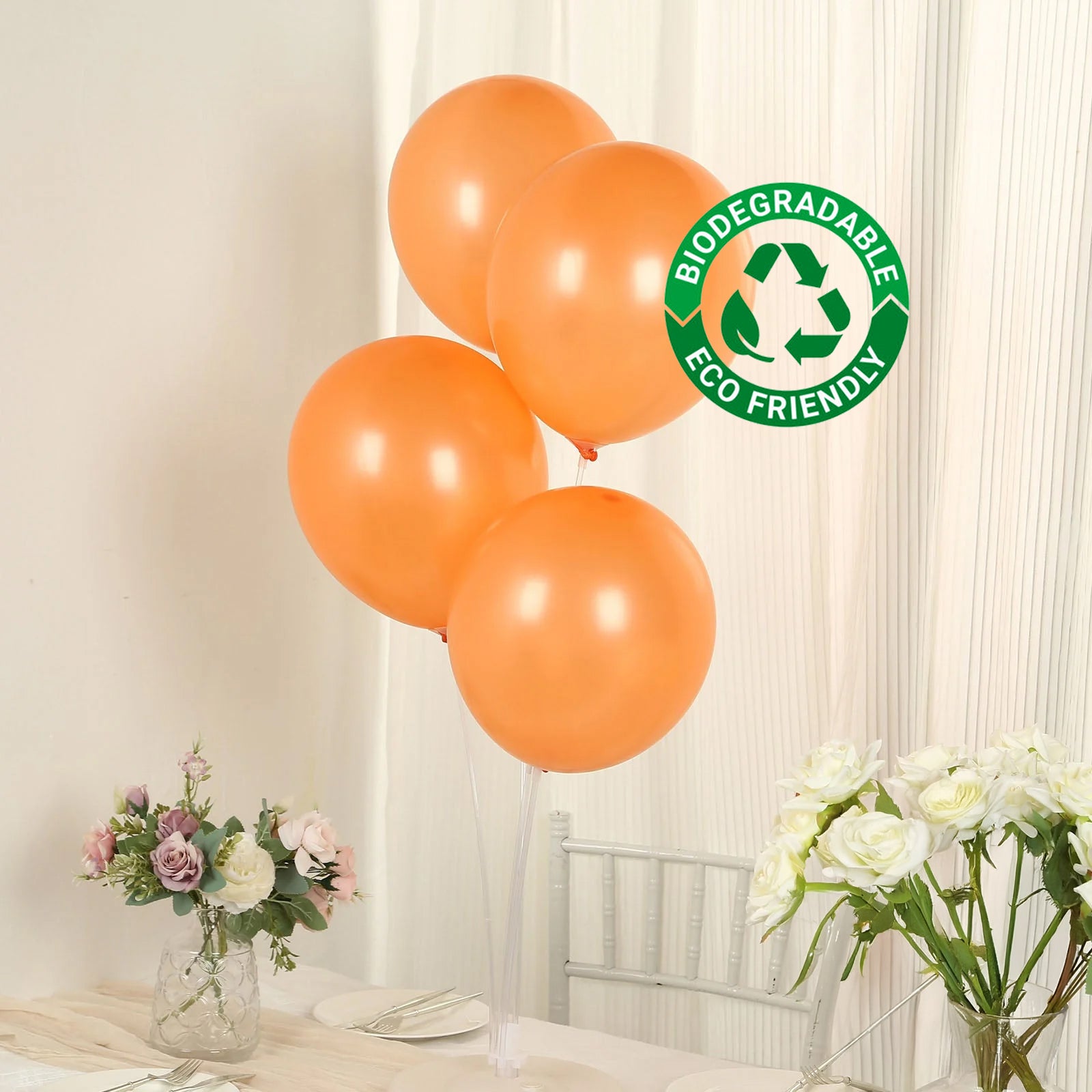 Orange biodegradable balloons for eco-friendly party decor.