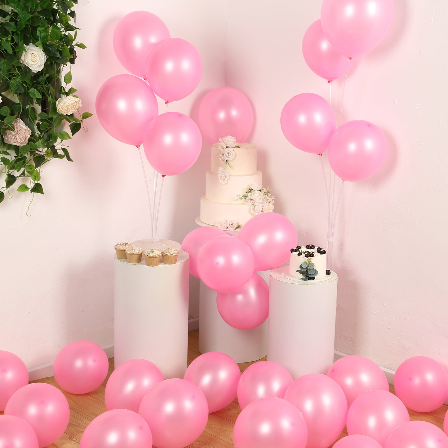 Pink biodegradable balloons in a festive party setting.