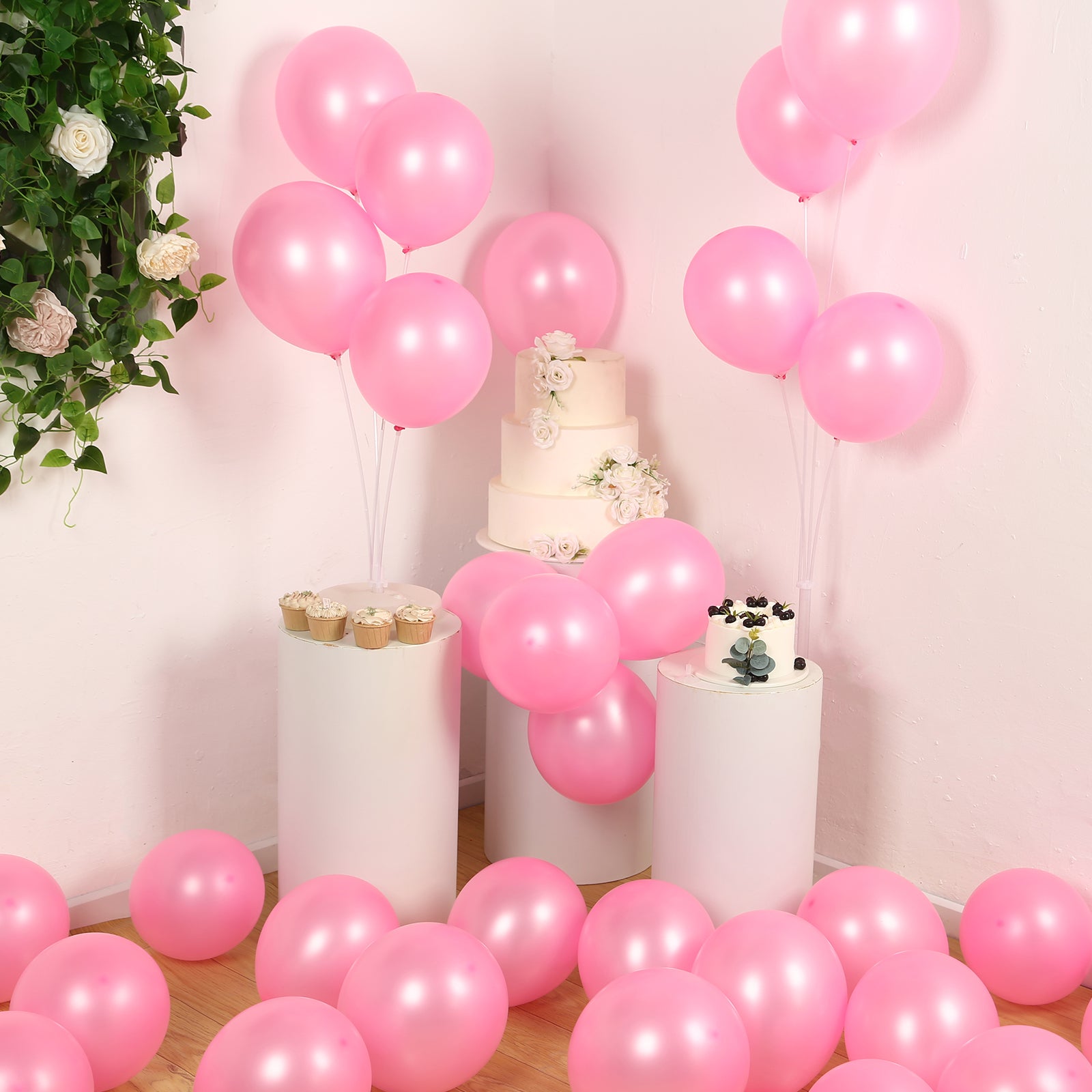 Pink biodegradable balloons in a festive party setting.