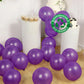 Purple biodegradable balloons scattered on the floor for a party.