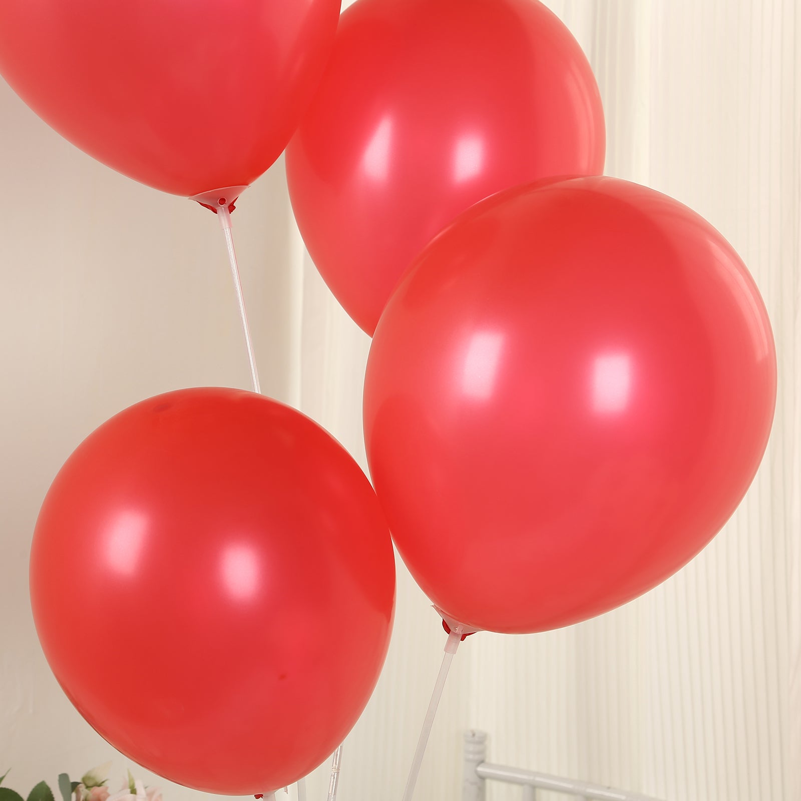 Red biodegradable balloons for eco-friendly celebrations.