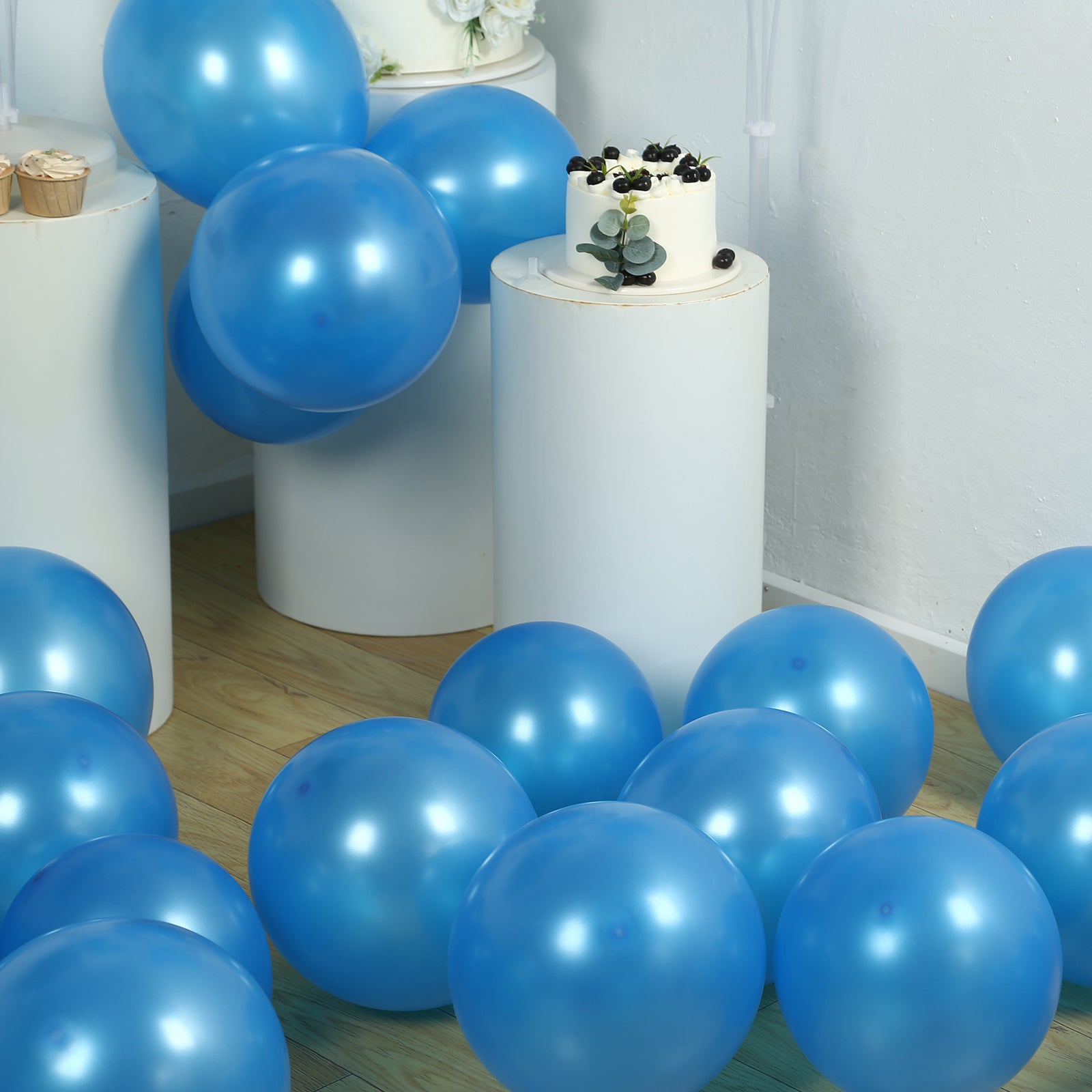 Royal blue biodegradable balloons scattered around a party setting.