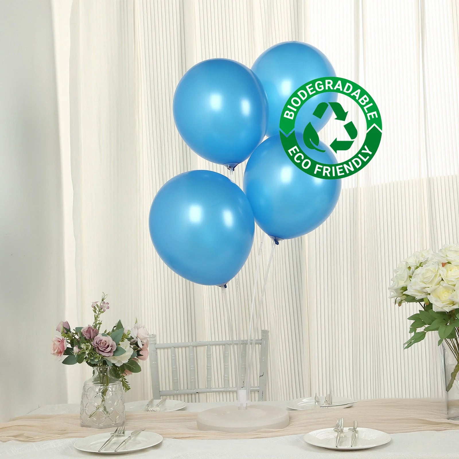 Royal blue biodegradable helium balloons on a table setting.