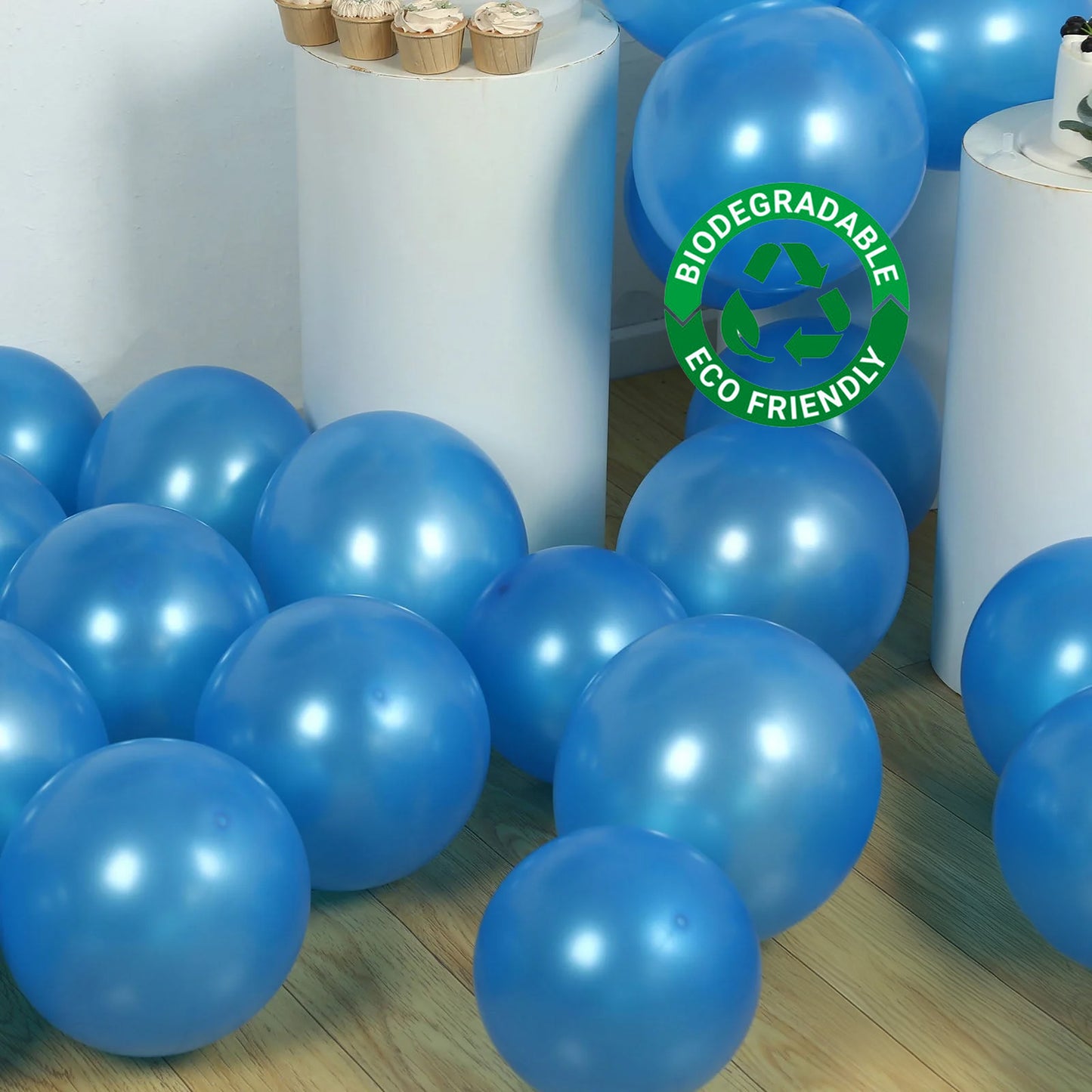 Royal blue biodegradable balloons scattered on the floor.
