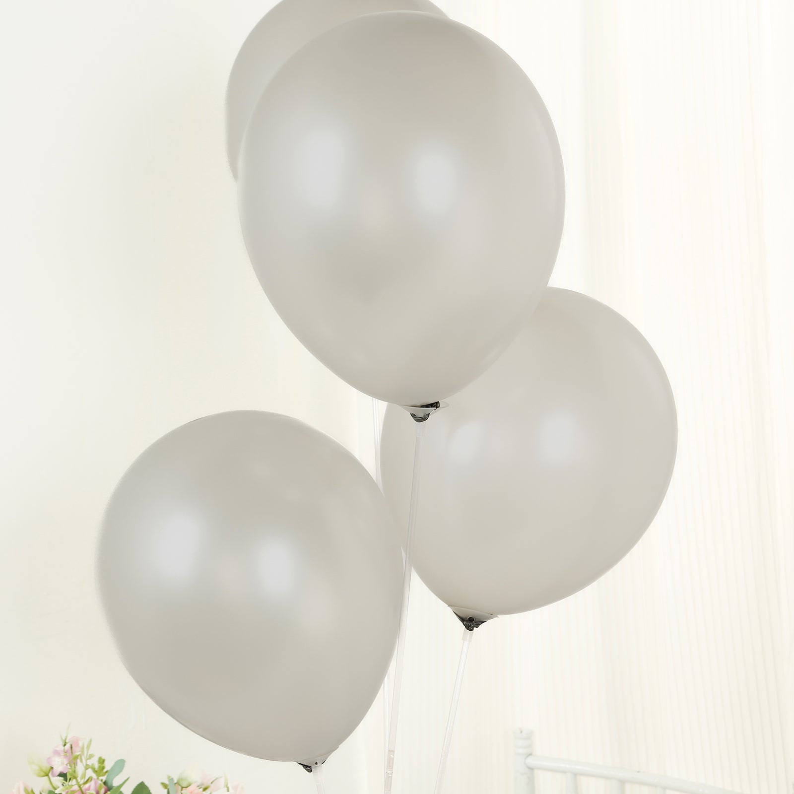 Silver biodegradable balloons for eco-friendly party decorations.