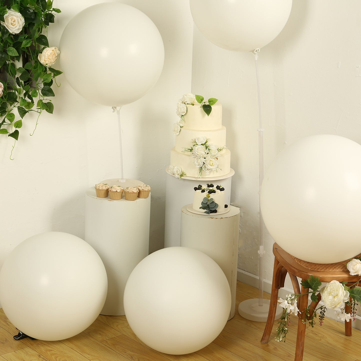 Off white biodegradable balloons in a festive party setting.