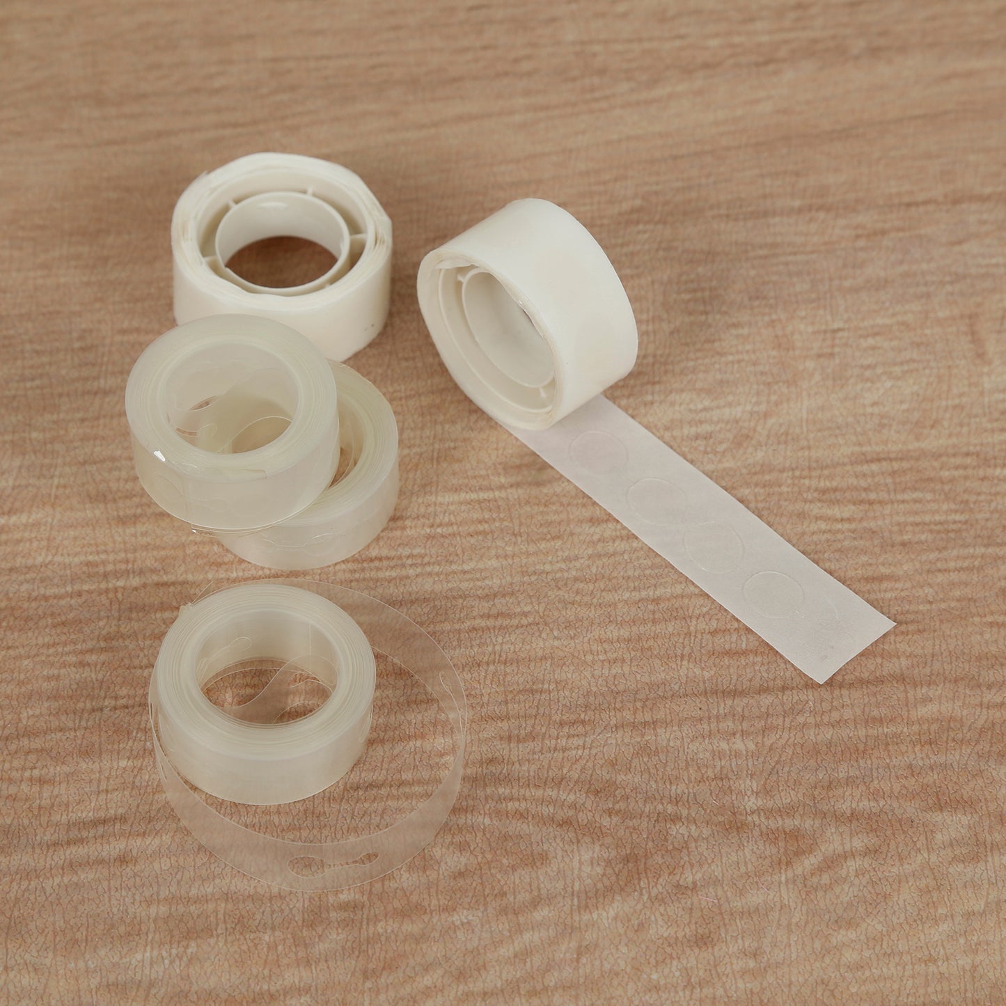 Clear balloon tape and glue dots for party decorations.
