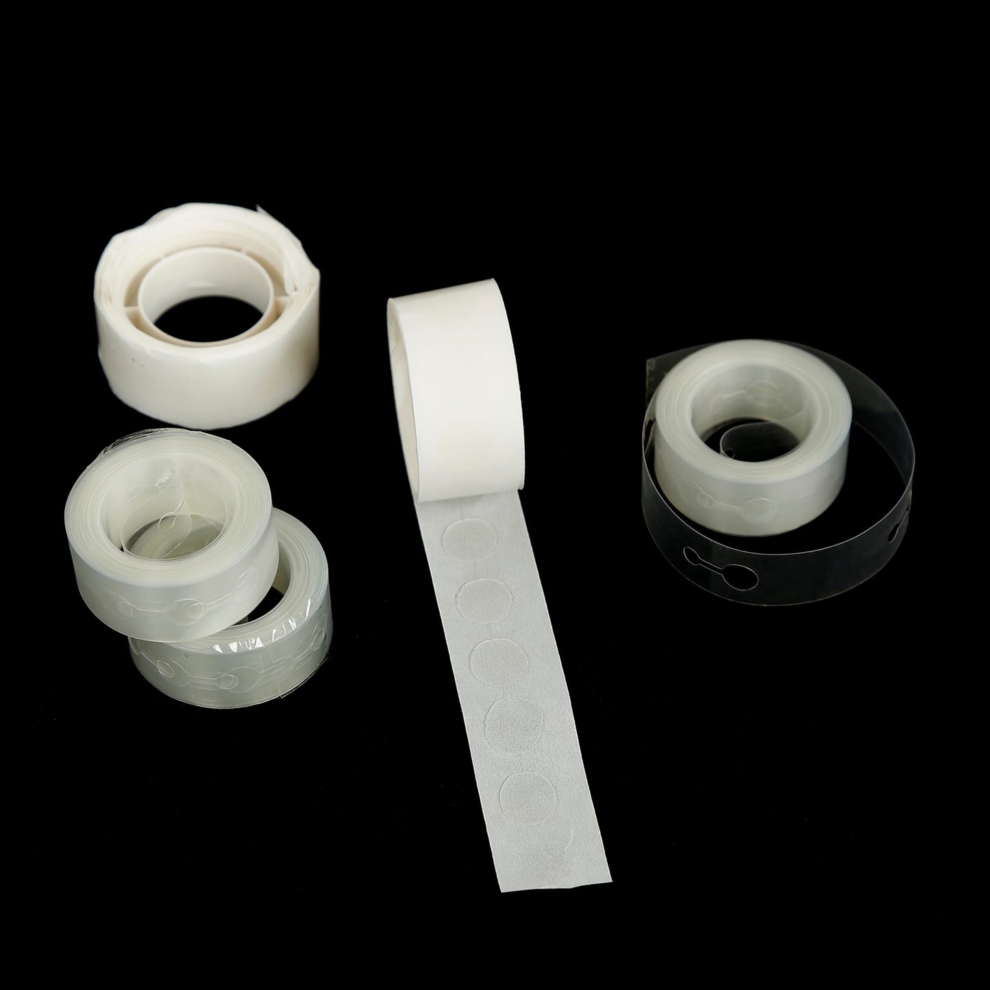 Clear balloon tape strips and glue dot rolls for party decorations.