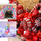 Red and pink candy striped swirl print mylar foil balloons.