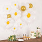 White daisy flower-shaped balloons with gold accents for party decorations.