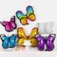 Assorted butterfly foil balloons in vibrant colors for fairy tale parties.