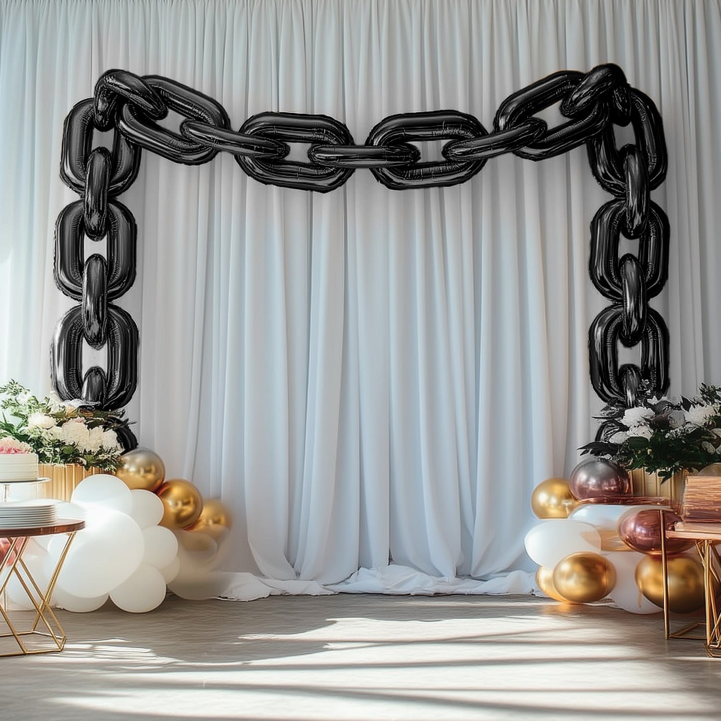 Black chain foil balloons creating a party arch backdrop.
