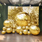 Metallic gold sphere balloons on a festive backdrop for party decorations.