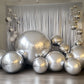 Metallic silver sphere balloons in a festive arrangement.
