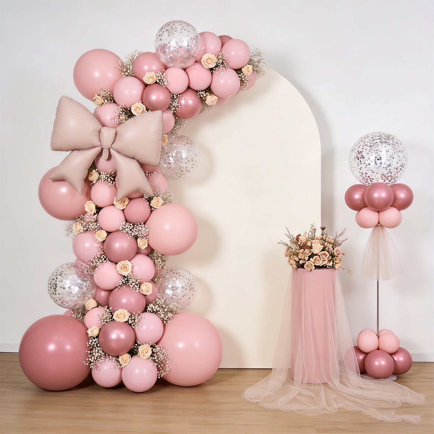 Matte blush decorative foil bow balloons for party backdrop and photo booth.