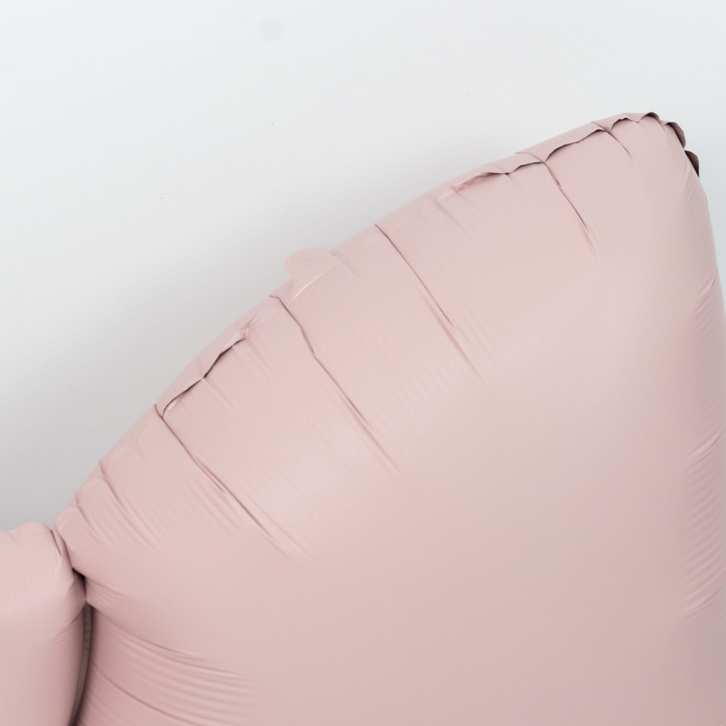 Matte blush decorative foil bow balloon for event styling.
