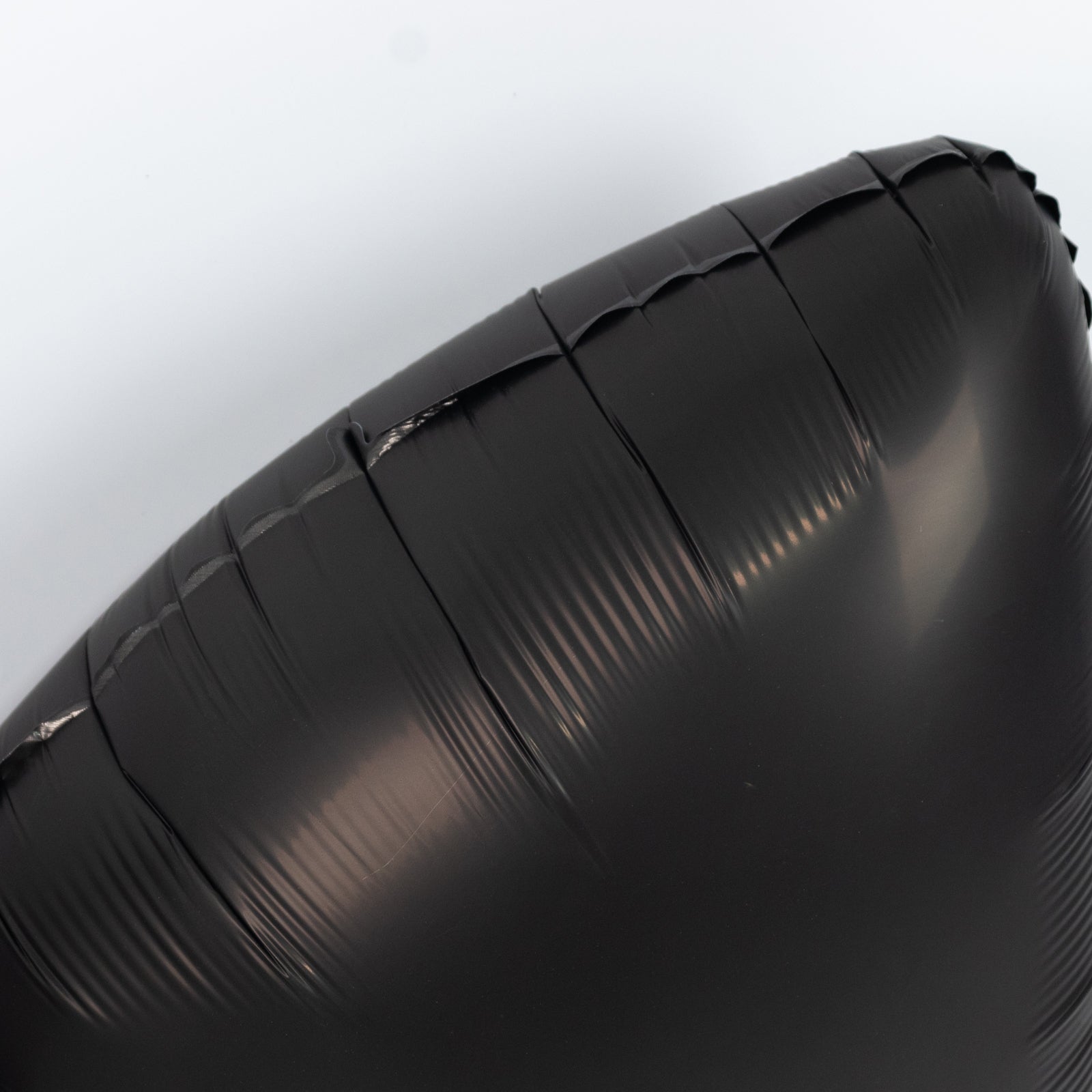 Matte black giant decorative foil bow balloon for party styling.