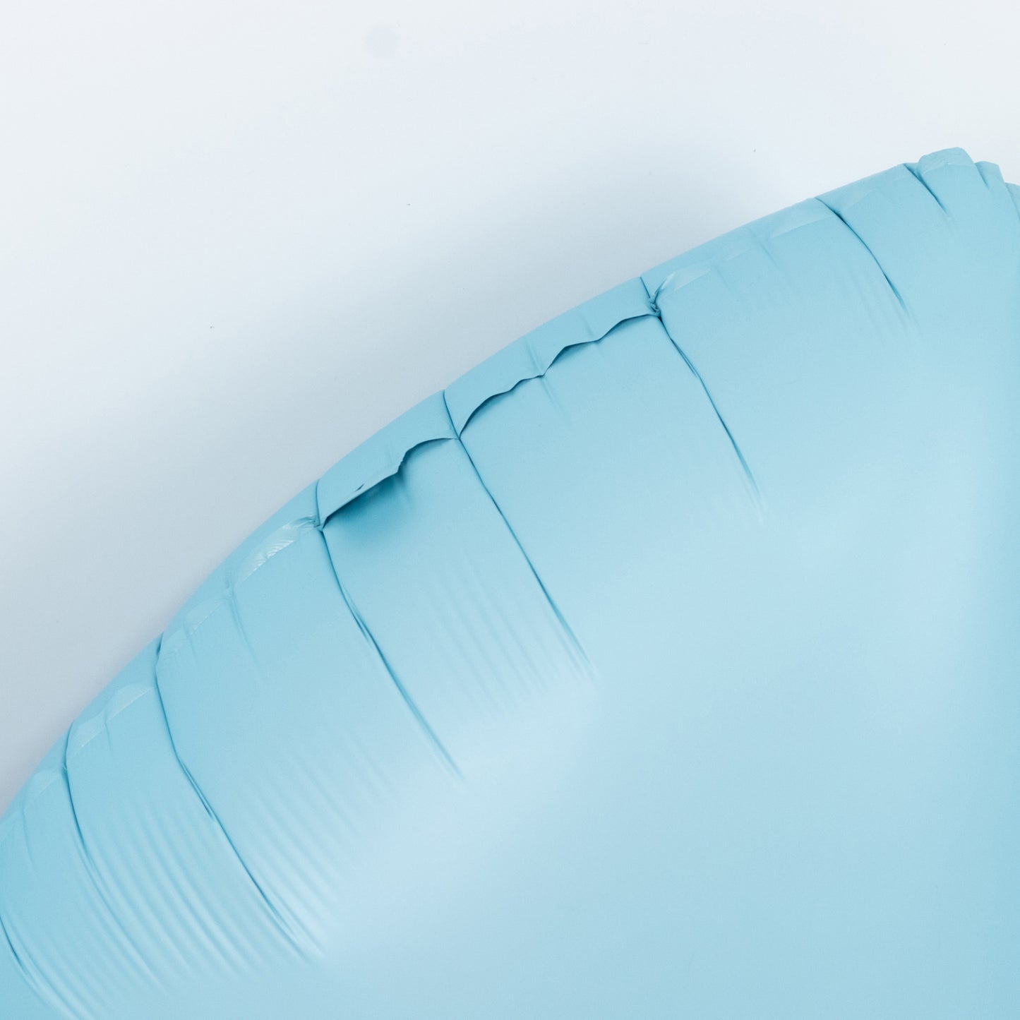 Matte light blue giant decorative foil bow balloon.