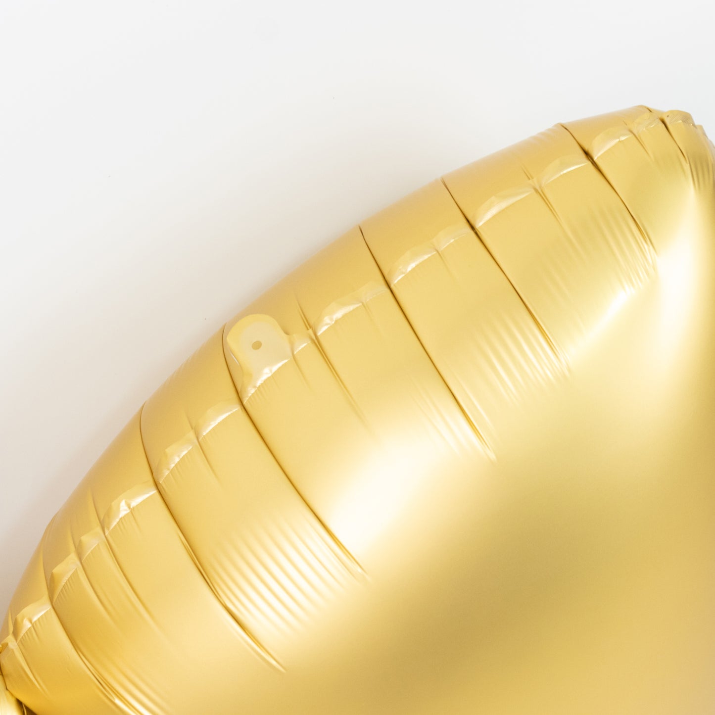 Matte gold giant decorative foil bow balloon, perfect for parties and events.