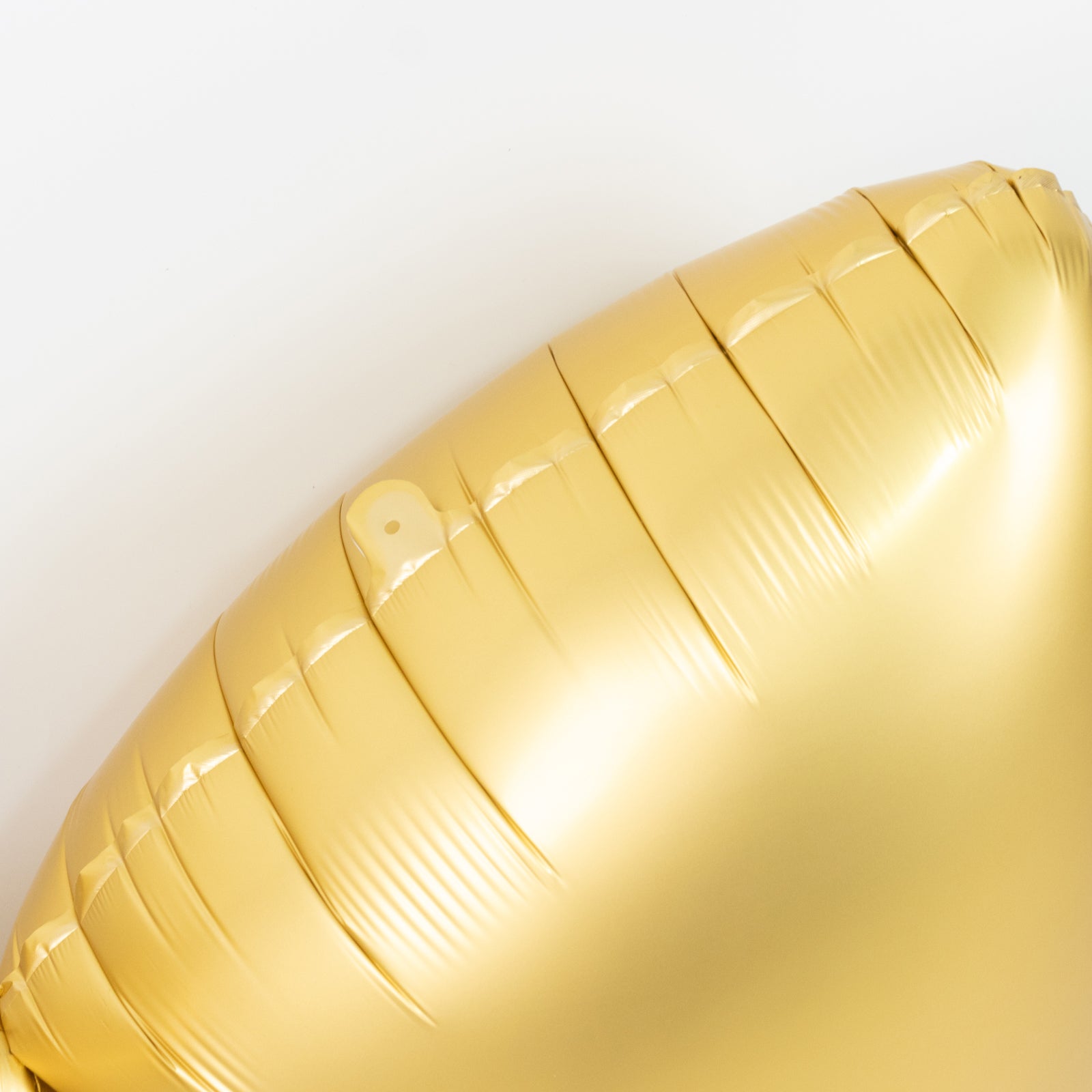 Matte gold giant decorative foil bow balloon, perfect for parties and events.
