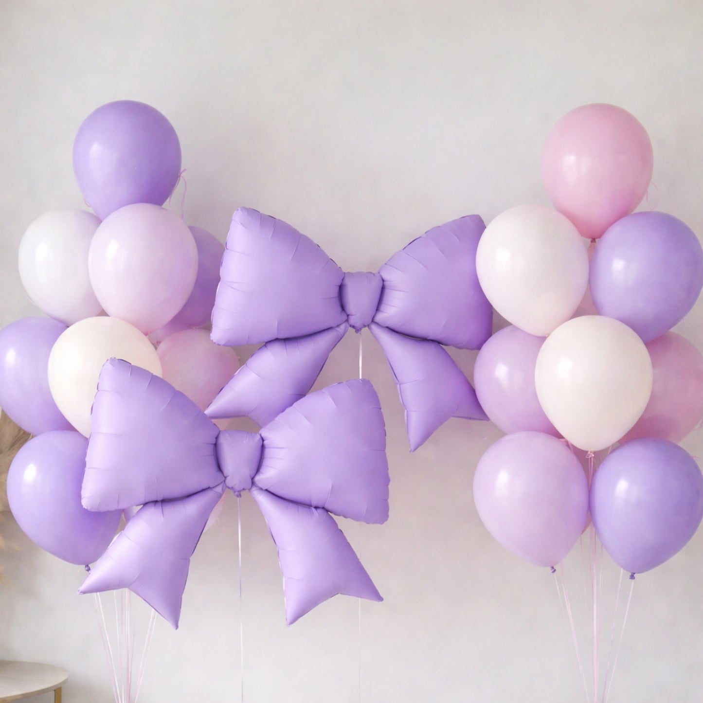 Matte lavender giant decorative foil bow balloons for event styling.