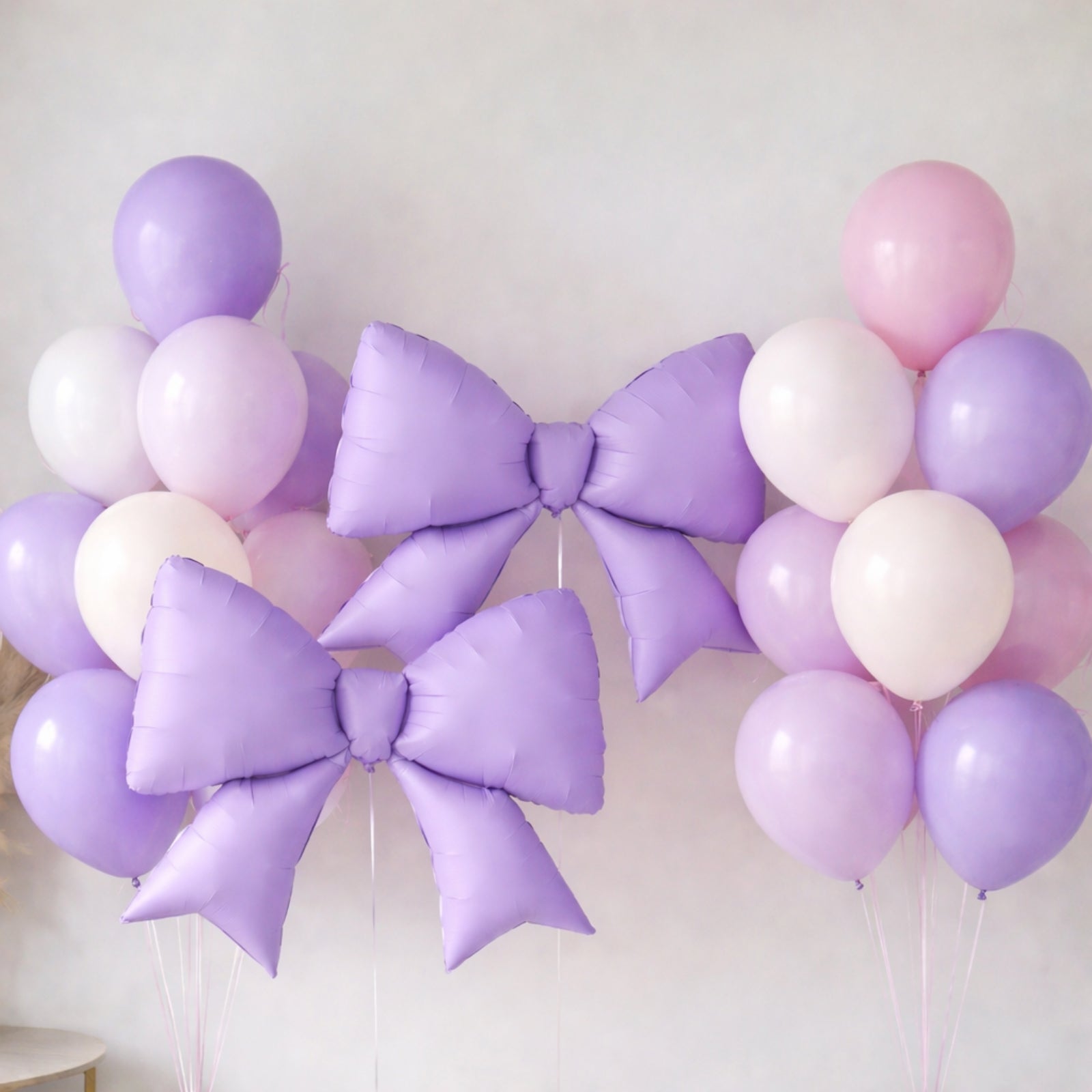 Matte lavender giant decorative foil bow balloons for event styling.